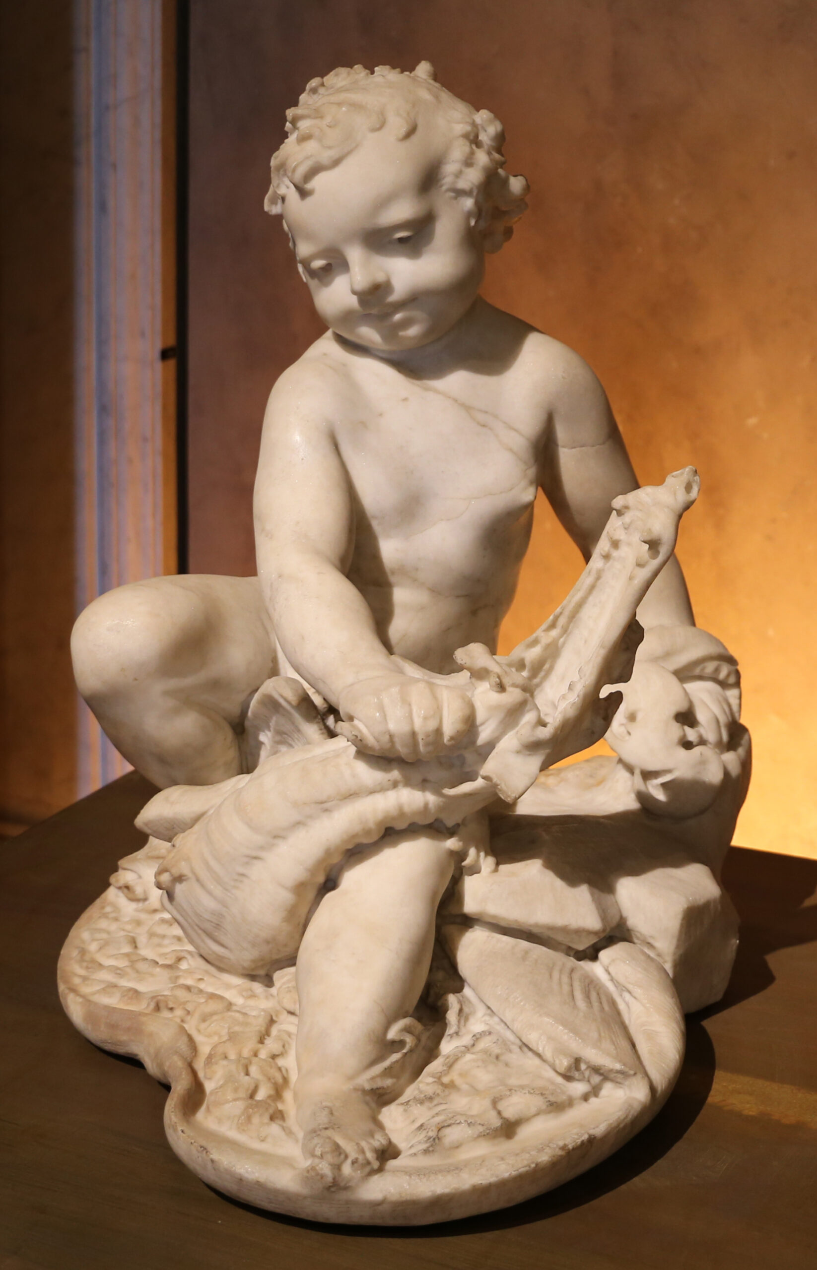 Putto auf einem Drachen